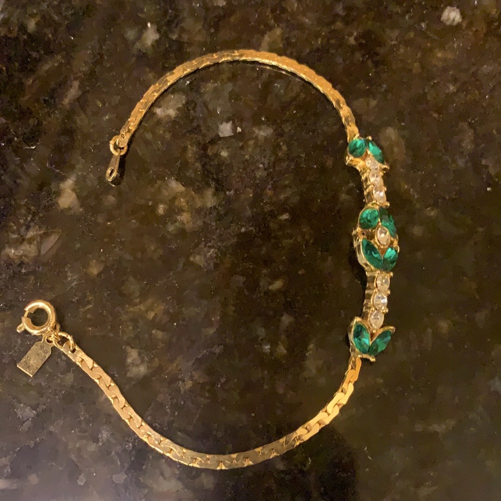 Faux emeralds in diamond gold tone bracelet